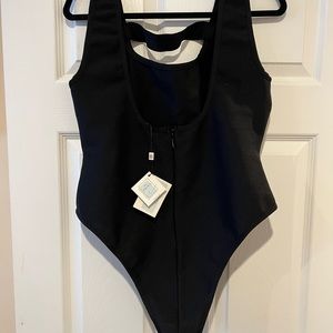 by Egreis body suit. Never worn with tags.